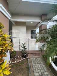 Front angle view of single-family house showing front terrace and garden area Los Santos Panama
