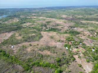 Aerial photo of farmland bordered by Rio Teta river San Jose Panama Oeste
