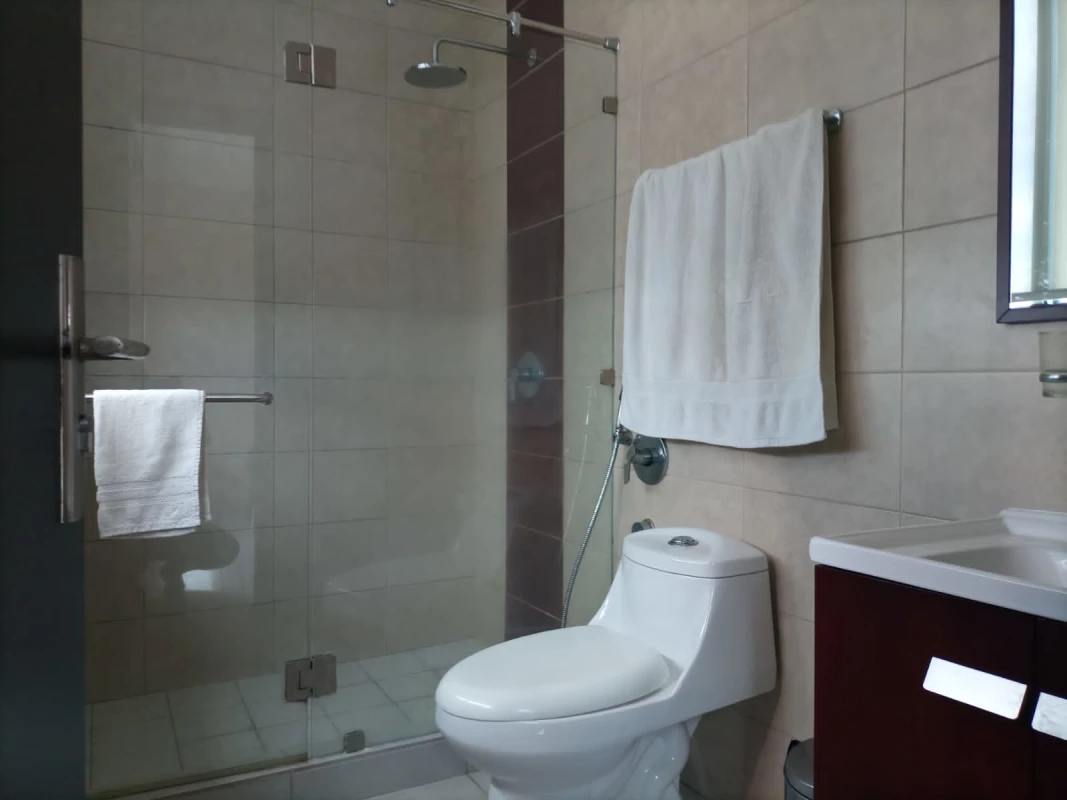 Modern open-plan living dining with large windows, tile floor in PH Premium Panama City