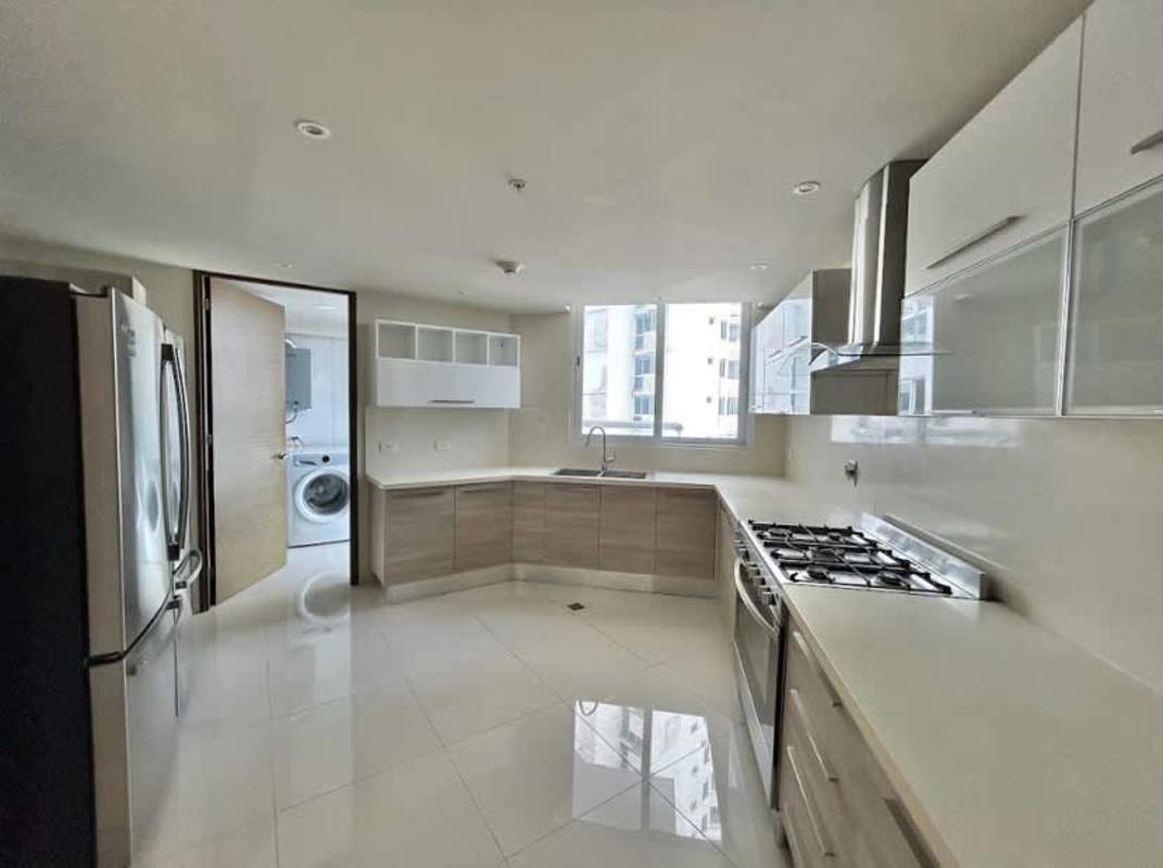 Modern dining area with large windows and city ocean views for sale PH The Regent Costa del Este Panama