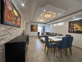 Open dining area with tile floor and recessed lighting in Arraiján house Hola Realty listing