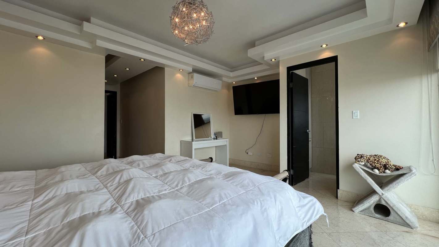 Master bedroom with walk-in closet and ensuite bath at PH Altos del Parque Hato Pintado Panama