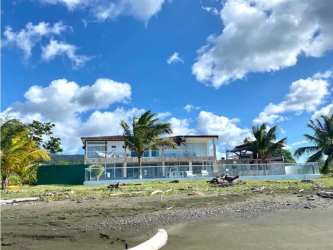 Aerial view luxury beachfront house with pool and gardens San Marino Portobelo Panama