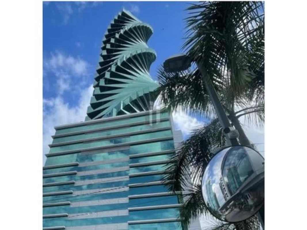 Large office with panoramic windows and city skyline ocean view in iconic twisting F&F Tower on Calle 50