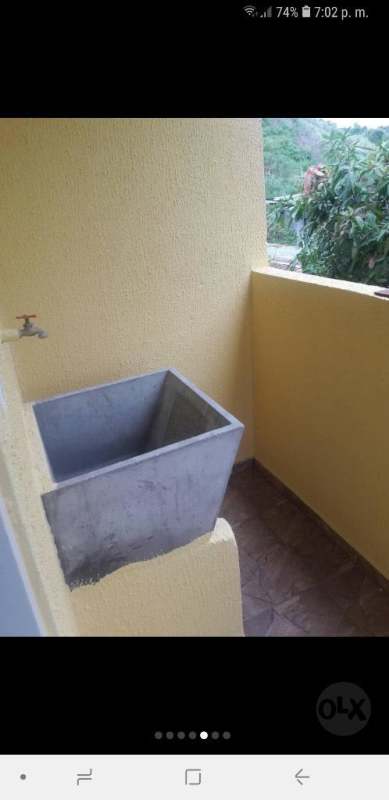 Exterior view of apartment balcony with metal roof in San Miguelito rental Panama