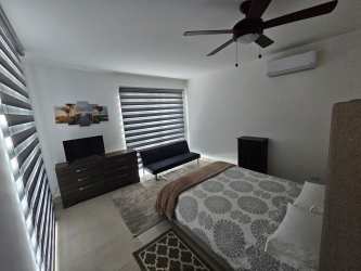 Bright guest bedroom with oceanview balcony AC PH Founders Playa Blanca Resort Panama