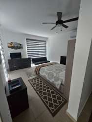 Modern secondary bedroom balcony access AC split fan PH Founders Playa Blanca Panama