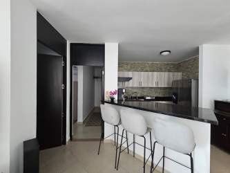 Open kitchen with granite countertops breakfast bar stainless appliances PH Founders Playa Blanca Panama