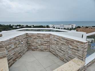 Rooftop penthouse outdoor shower stone tile modern fixtures ocean view Panama