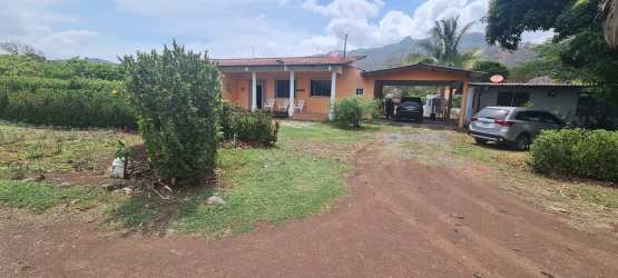 Country house in Espave with carport, garden, front porch, mountain backdrop near Coronado beaches