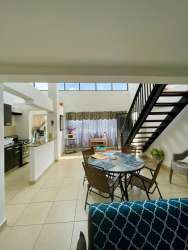 Bright open living space with vaulted ceiling and loft bed Brisas de Coronado Panama