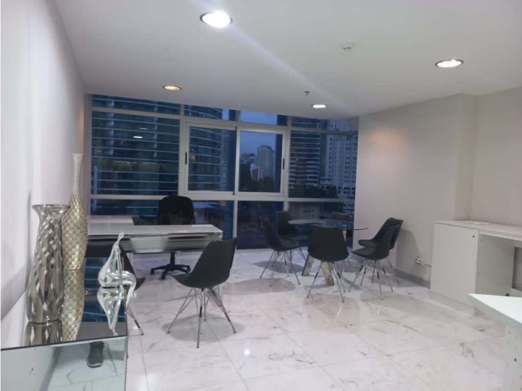 Modern glass tower with balconies and parking entrance in Bella Vista PH Colores Panama City