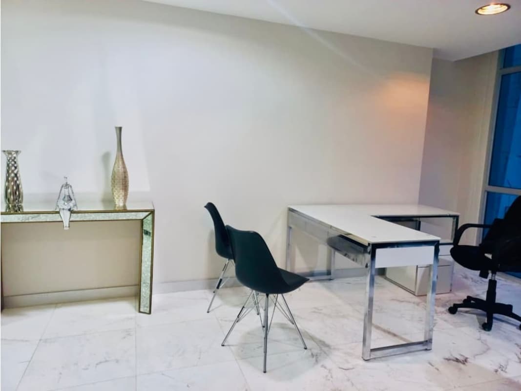 Colorful lobby with high ceilings and glass balcony at PH Colores Bella Vista Panama