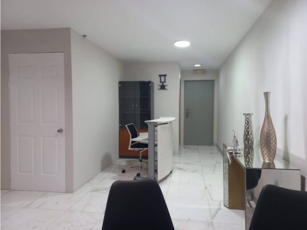 Glass table and black chairs in meeting room with panoramic windows PH Colores Bella Vista Panama