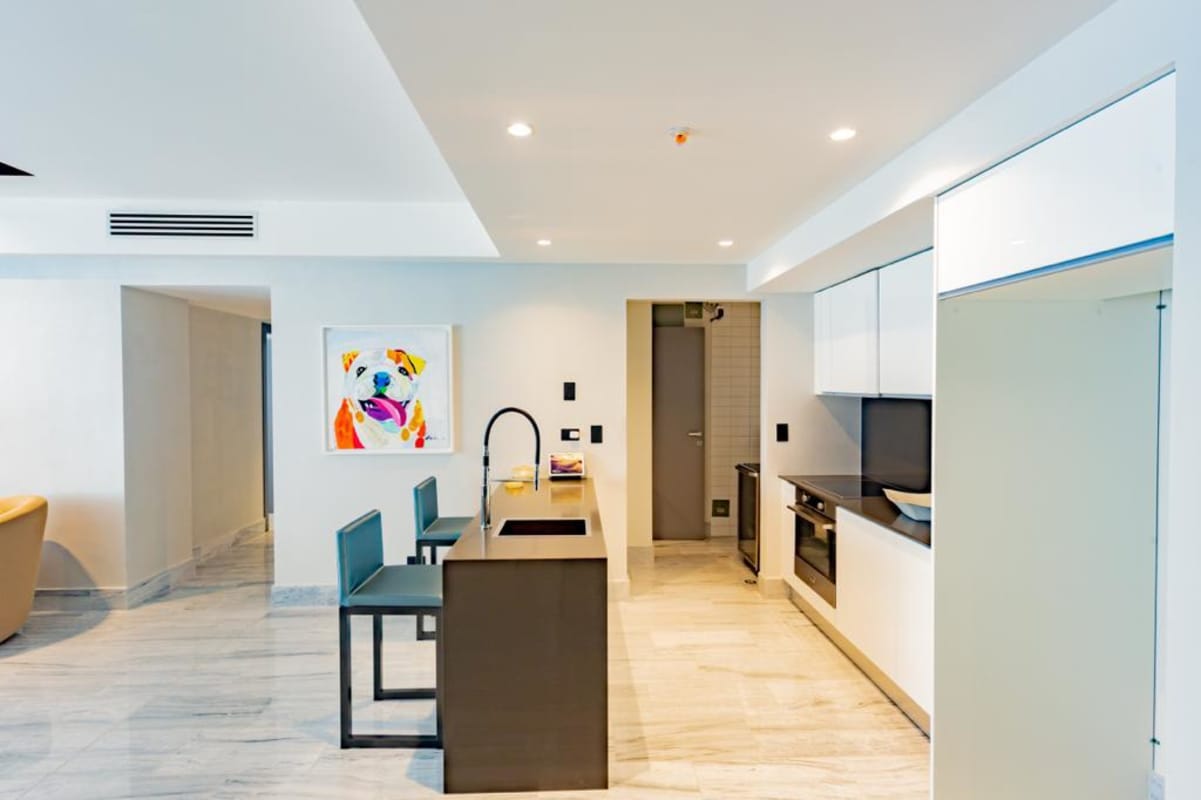 Contemporary kitchen with marble island and designer appliances in Nuovo Armani Panama