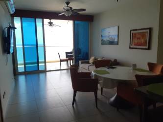 Open kitchen with granite countertops and appliances in beachfront condo Panama
