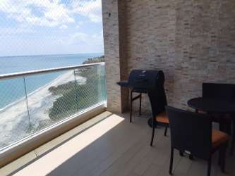 Bedroom with double bed and ocean view balcony in PH Santa Clara Residences