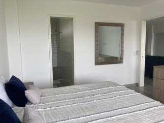 Bright bathroom with glass enclosed shower Bahía de los Vientos Punta Chame Panama