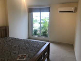 Contemporary bedroom with split AC twin beds and closet in Playa Dorada Panama