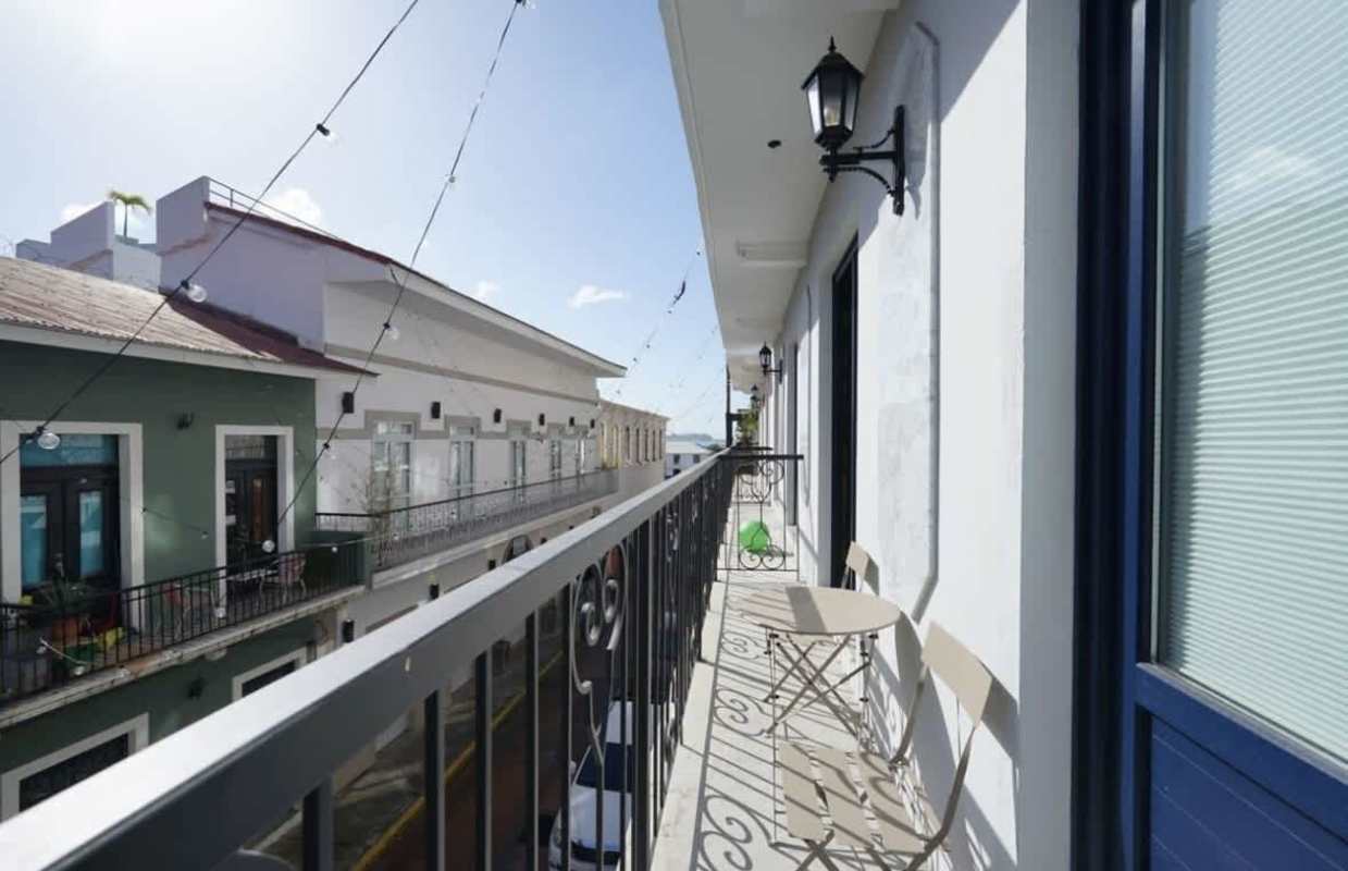 Private balcony with wrought iron railing overlooking Casco Viejo streets in Panama City