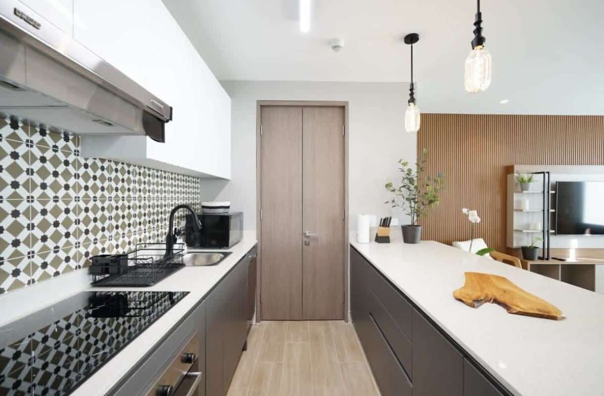 Modern kitchen with island, premium appliances, and stylish backsplash in Casco Viejo Panama