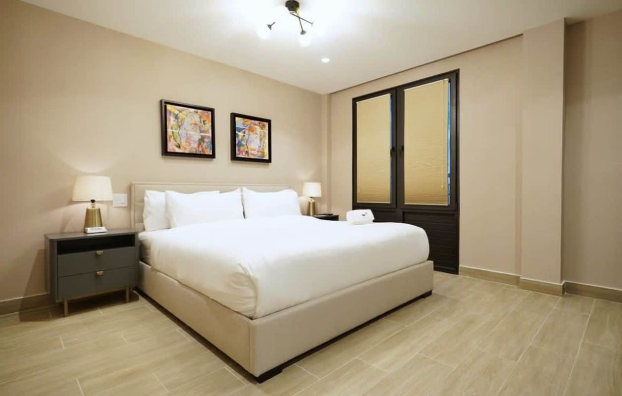 Elegant bedroom with modern furnishings and abundant light in Casco Viejo Panama