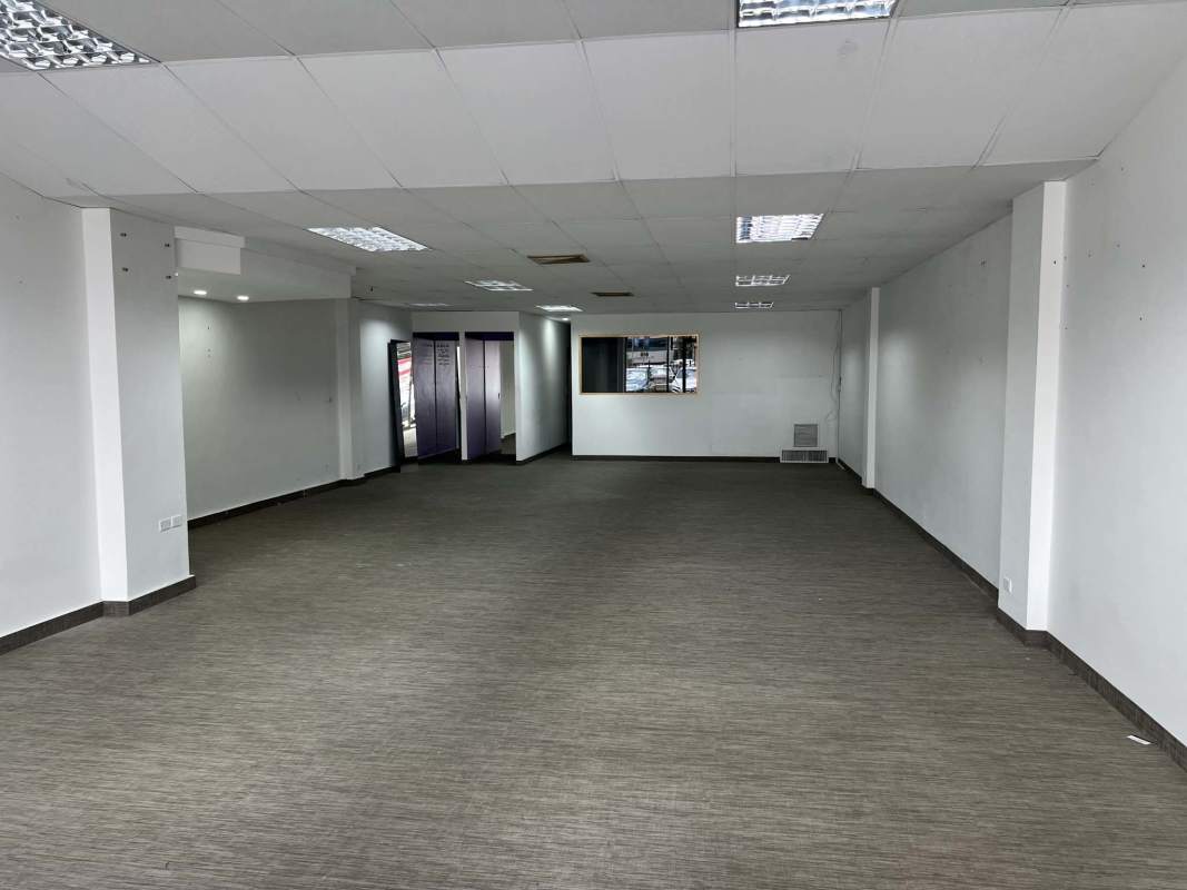 Spacious commercial retail interior with drop ceilings and lighting Plaza Marbella Panama