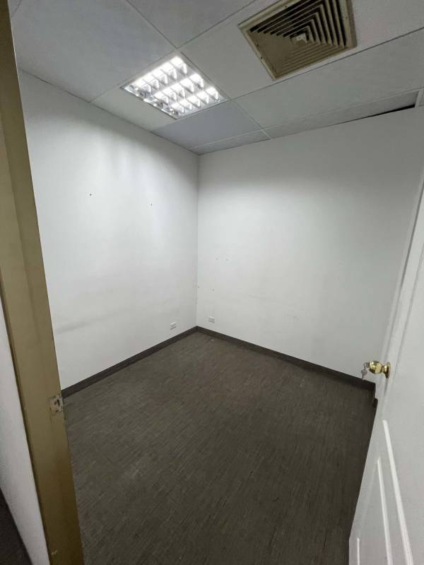 Vacant commercial space with drop ceilings and carpet Plaza Marbella Panama