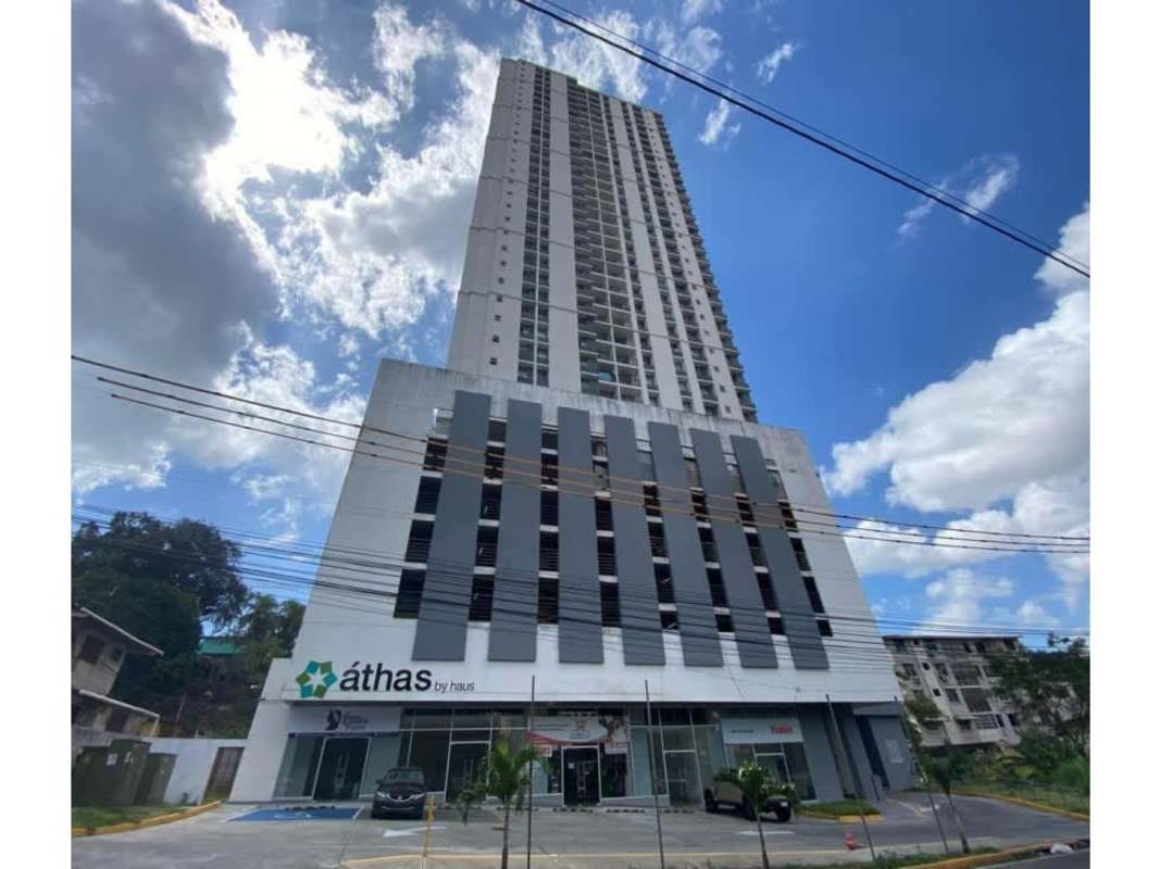 Contemporary high-rise building with commercial storefront and balconies at Athas City Tower Panama