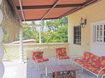 Covered terrace area with outdoor seating Los Paz de Chame dual residences for sale