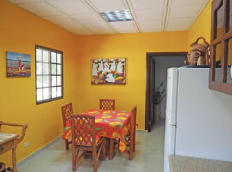 Bedroom with wooden furniture, ensuite bath, ceiling fan in La Paz de Chame estate