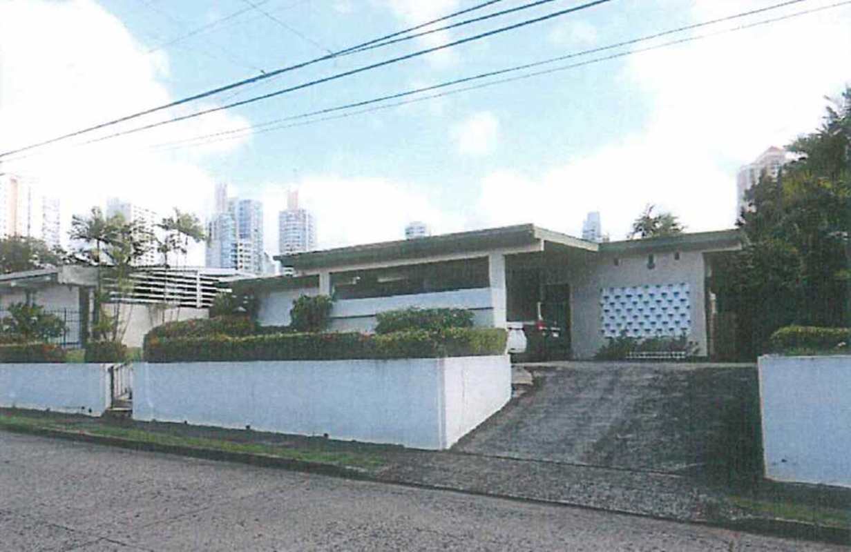 Spacious living and dining area with windows and French doors in Villa Lilla home Panama City
