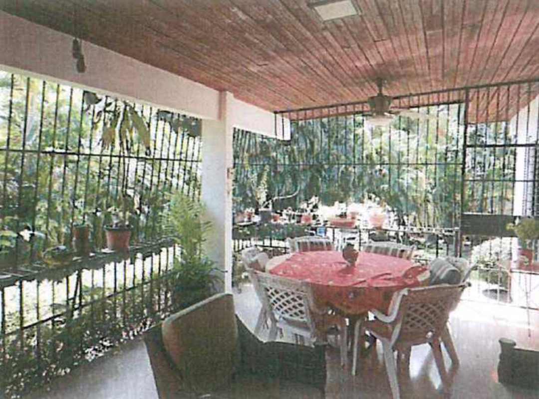 Bright kitchen with white cabinets and large windows in Villa Lilla home Panama City