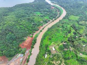 Aerial tropical forest river delta and cleared land prime beachfront site Palenque Panama