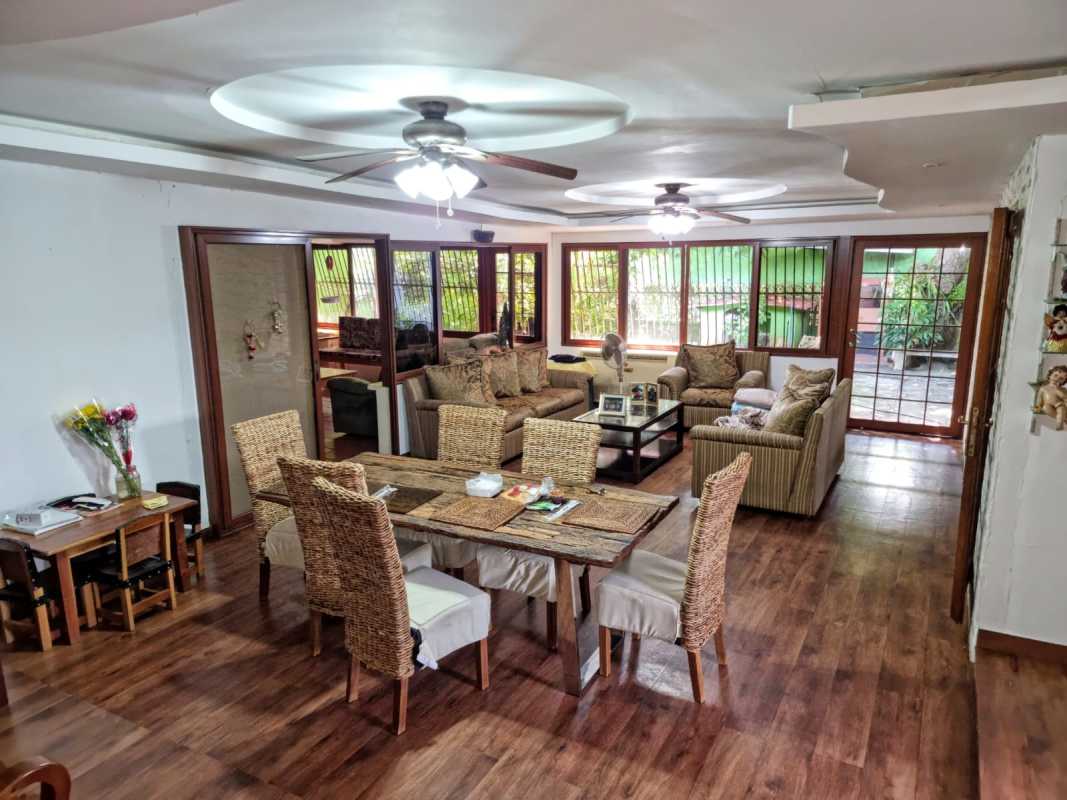 Open plan living dining area with wooden accents in Betania home Panama