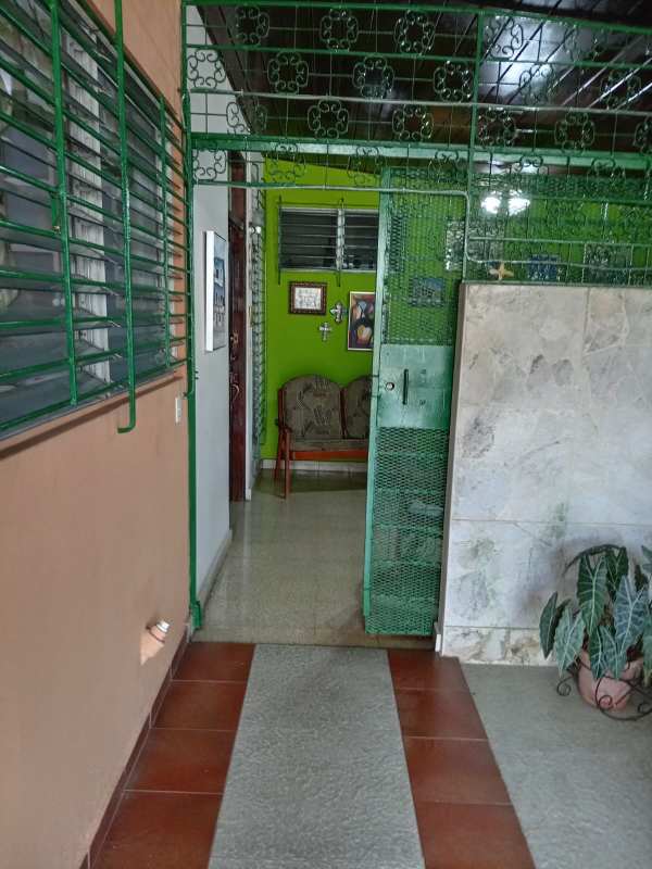 Traditional kitchen with tile walls cabinets double sink microwave Betania house Panama
