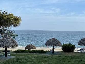 Contemporary kitchen with stainless appliances, ample storage, oceanfront apartment at Bijao Beach Panama