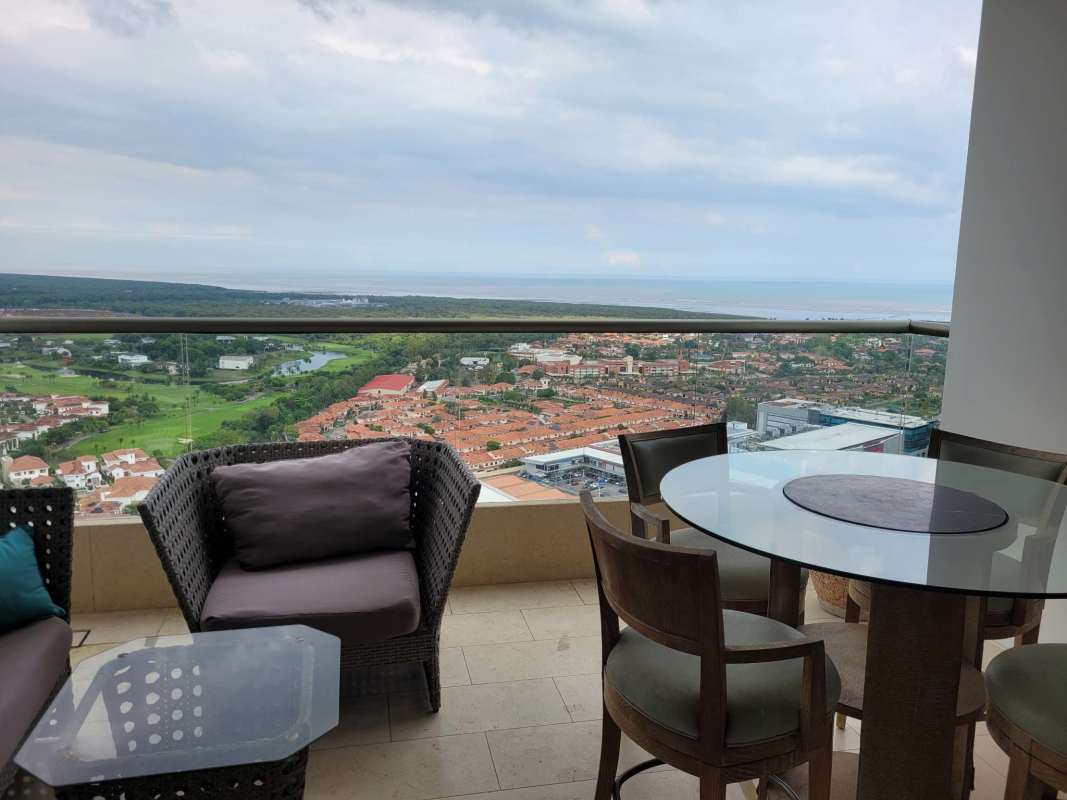 Elegant living and dining room with large windows and view at PH Green View Santa Maria Panama