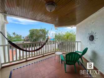 Covered terrace balcony with hammock and seating overlooking Pacific Ocean in Malibu Nueva Gorgona Panama beach house rental