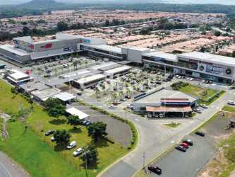 Modern shopping plaza with parking adjacent to Panamerican Highway La Chorrera Panama Oeste