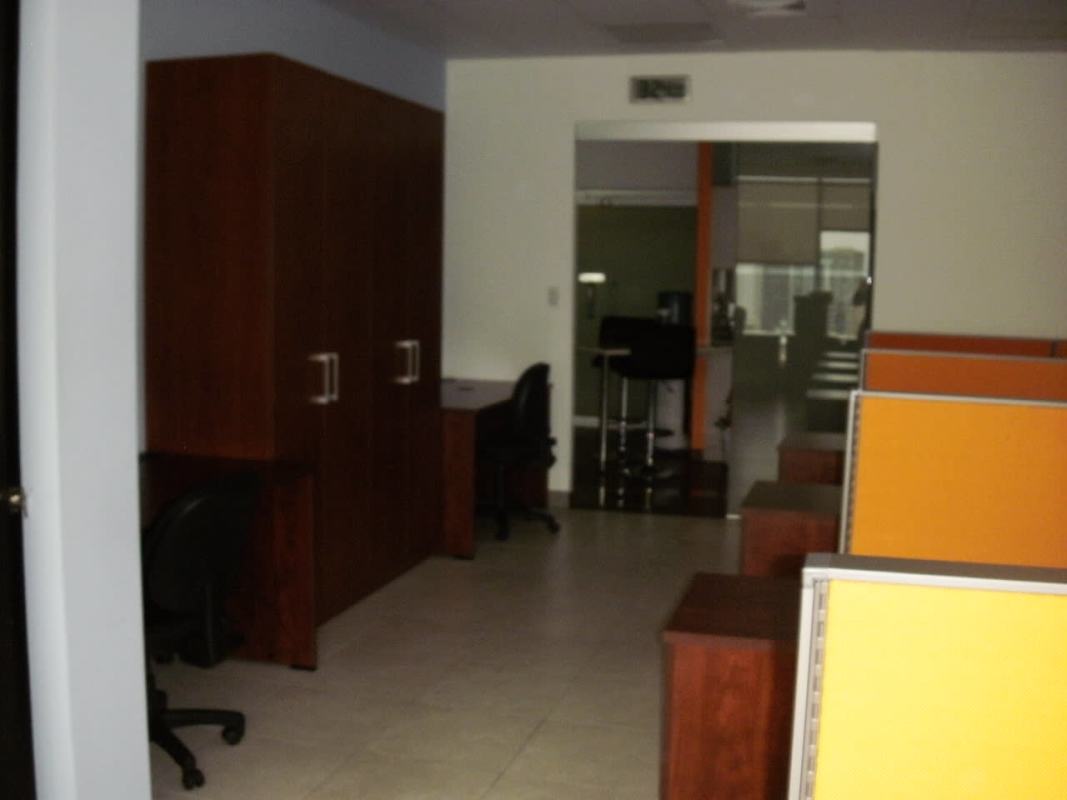 Partitioned cubicle workspace inside fully equipped office in Marbella