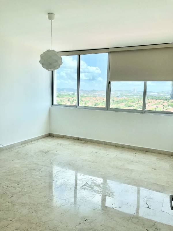 Master bedroom with marble floors, large windows and sea views in luxury apartment Panama City