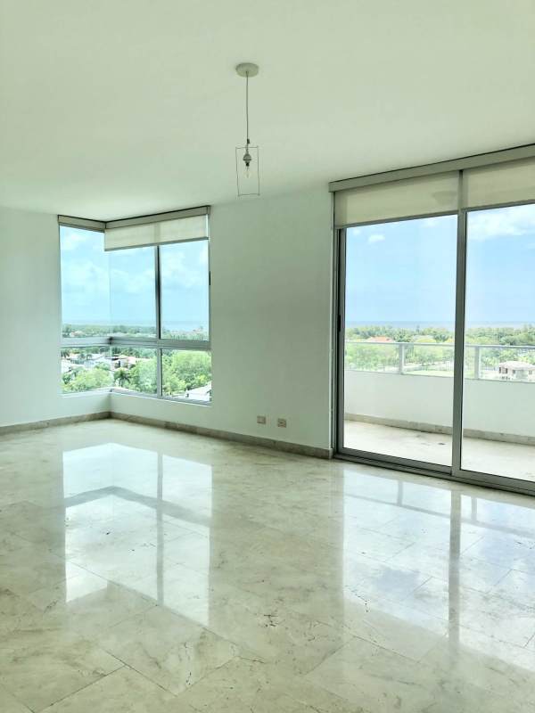 Spacious dining area with marble floors and large windows opening to ocean view balcony Panama