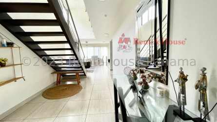 Spacious green backyard with shaded terrace and barbecue area in PH Nativa residential Panama Pacifico