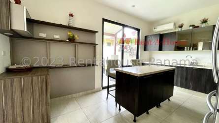 Fully fitted modern kitchen with granite countertops, refrigerator, oven and ceramic flooring at PH Nativa Panama Pacifico