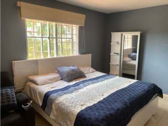 Swimming pool and kids playground in gated community Villas del Pinar Panama Oeste