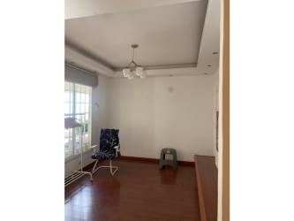 Spacious bedroom with closet, natural light, garden view in Villas del Pinar Arraiján