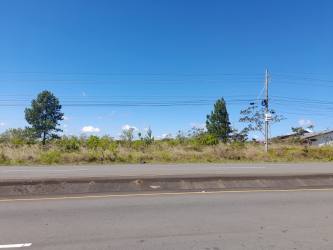 Large roadside lot with paved access and utility poles, development land in Boquete Panama for sale