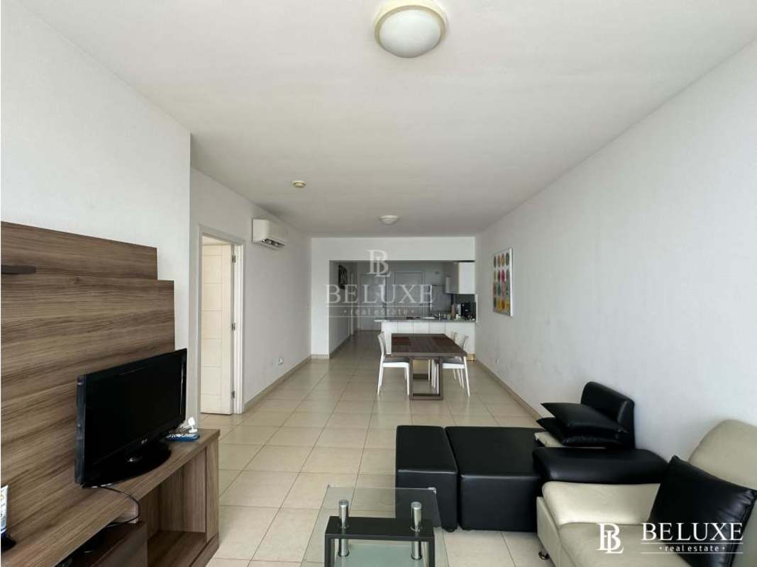 Bedroom featuring ocean view window, AC, and built-in closet at PH White Tower Panama