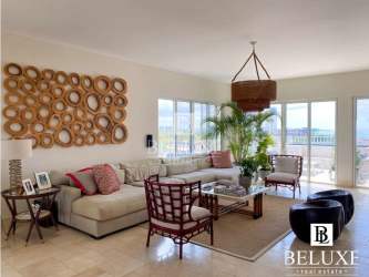 Elegant master bedroom with sliding doors to terrace and ocean views in luxury penthouse Puntarena